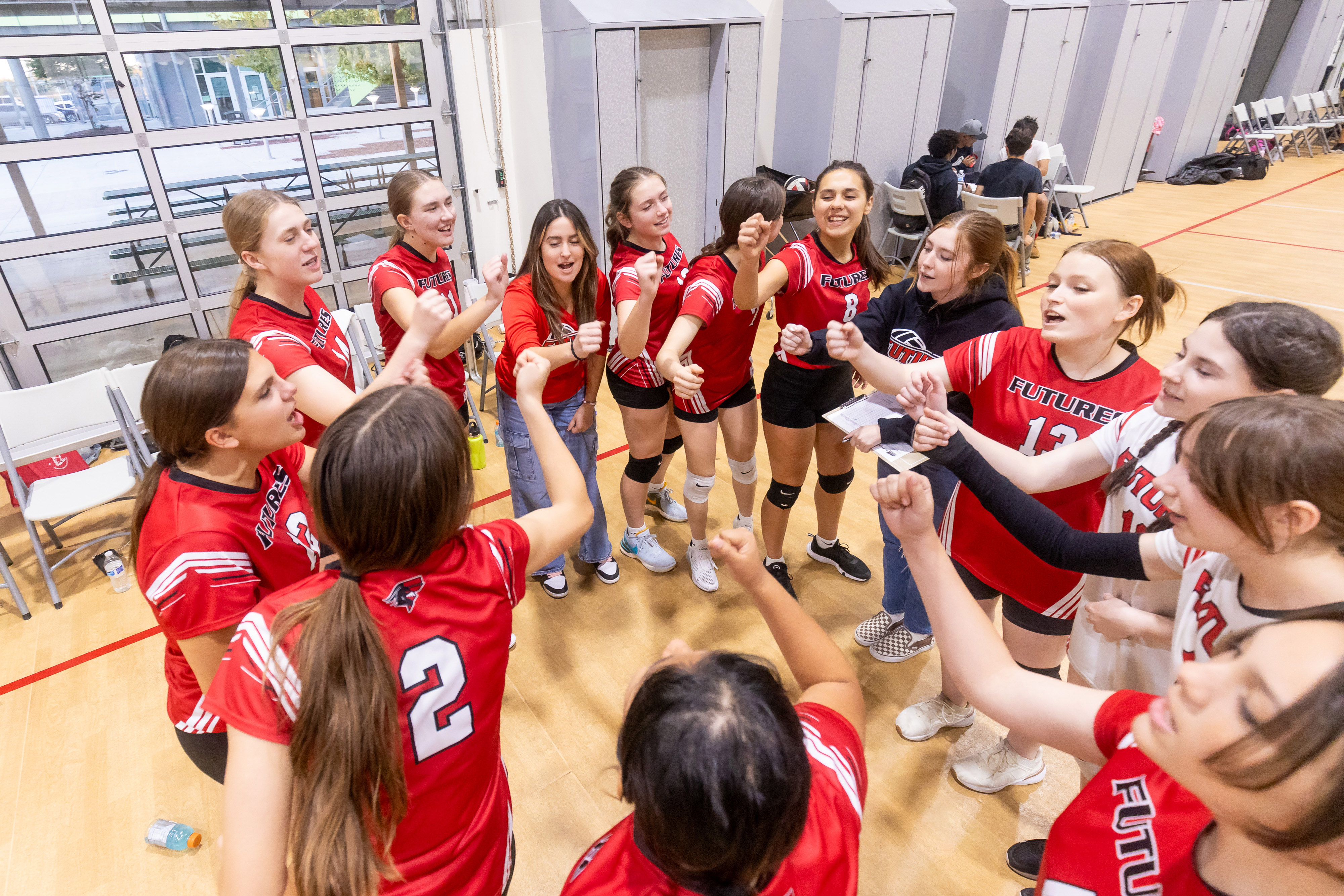 Girl's volleyball players in huddle