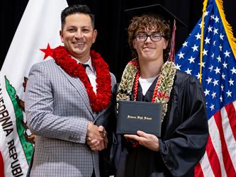 futures principal posing with graduating student