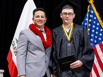 futures principal posing with graduating student