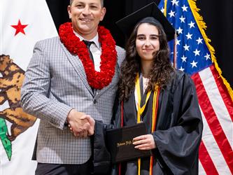 futures principal posing with graduating student