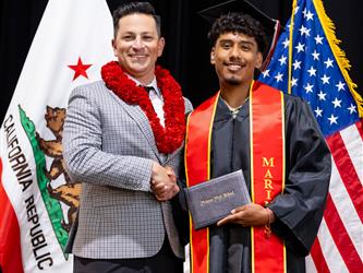 futures principal posing with graduating student