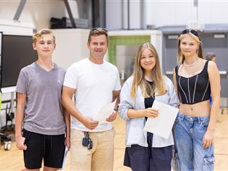 group of 4 students posing