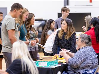 students engaging with staff