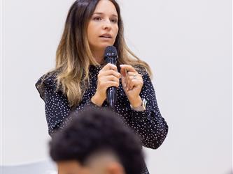 woman speaking into microphone 