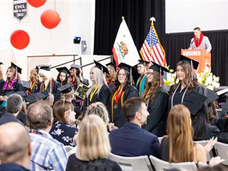 grad student walking off stage