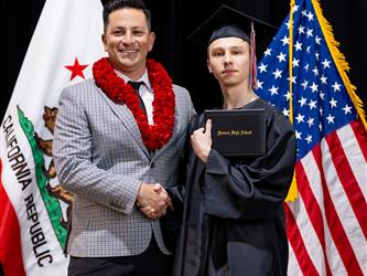 futures principal posing with graduating student