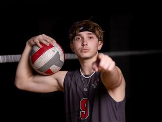 Volleyball player pointing at camera