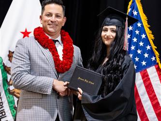 futures principal posing with graduating student