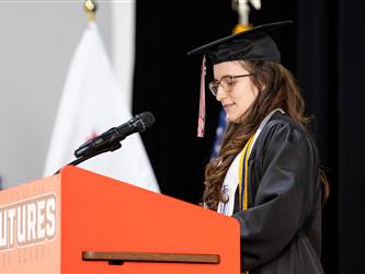 student speaking at podium