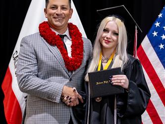 futures principal posing with graduating student