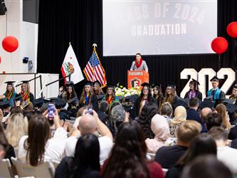 staff addressing grad class 