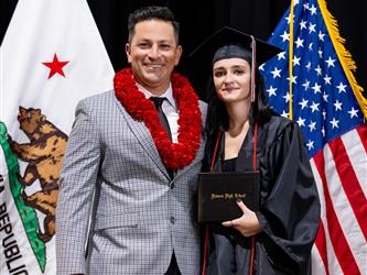 futures principal posing with graduating student