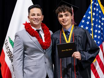 futures principal posing with graduating student