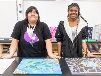 students posed at table