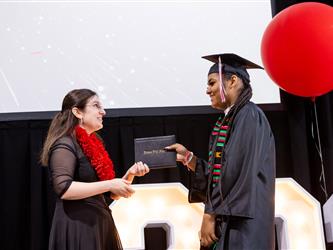 futures principal posing with graduating student