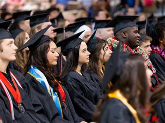 wide shot of futures graduates sat down