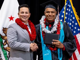 futures principal posing with graduating student