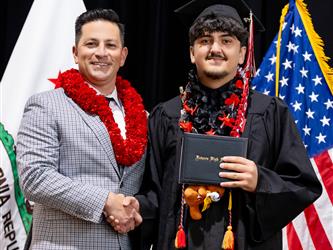 futures principal posing with graduating student