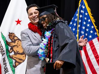 futures principal posing with graduating student