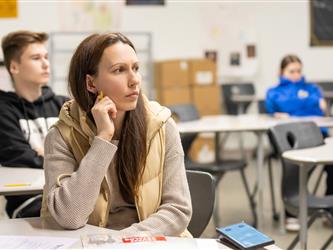 guest listening to speaker in class