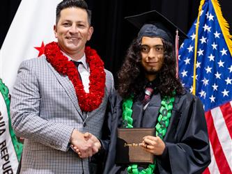 futures principal posing with graduating student