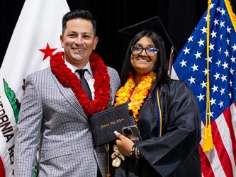 futures principal posing with graduating student