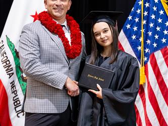 futures assistant principal posing with graduating student