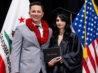 futures principal posing with graduating student