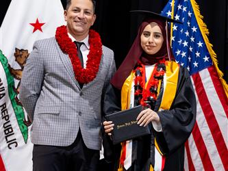 futures principal posing with graduating student