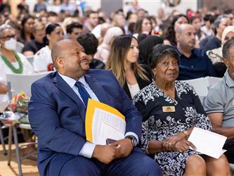 wide shot of futures graduates sat down