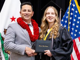 futures principal posing with graduating student