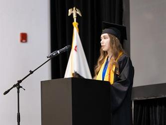 Student speaking at podium