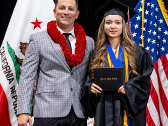 futures principal posing with graduating student