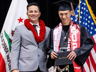 futures principal posing with graduating student