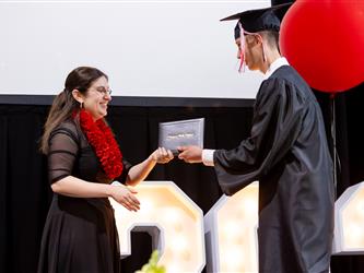 futures principal posing with graduating student