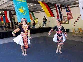 2 students dancing in cultural attire