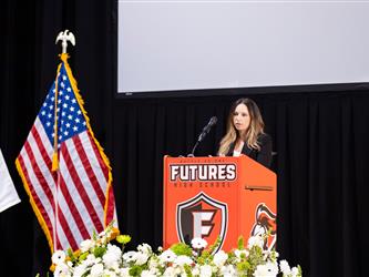 student speaking at podium