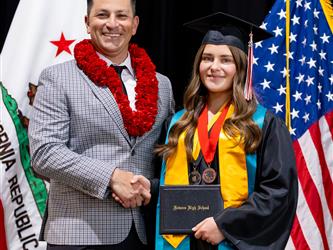 futures principal posing with graduating student