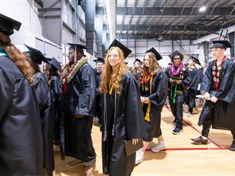 futures assistant principal shaking hands with graduating student