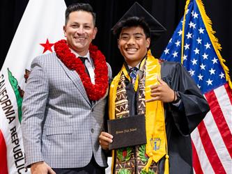 futures principal posing with graduating student