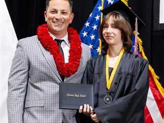 futures principal posing with graduating student