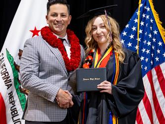 futures principal posing with graduating student