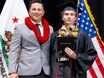 futures assistant principal posing with graduating student