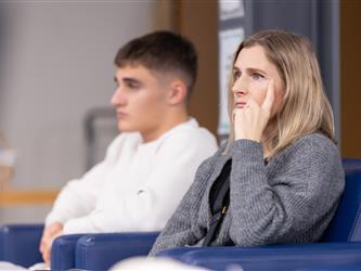 guests listening to speaker