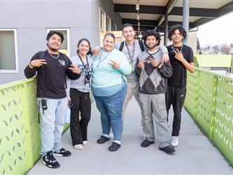 student group photo on bridge