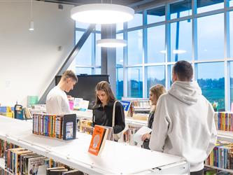 group shot of students in library 