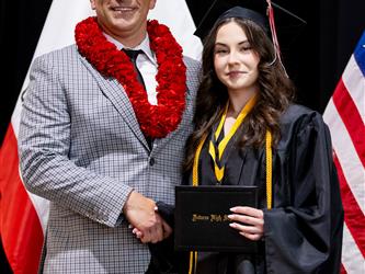 futures principal posing with graduating student