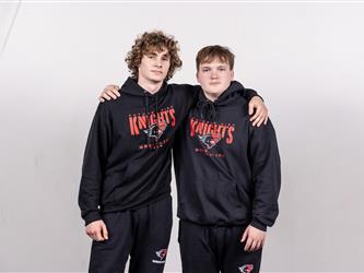 Two wrestling teammates posing