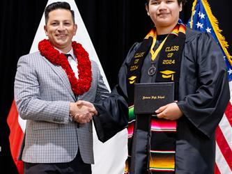 futures principal posing with graduating student