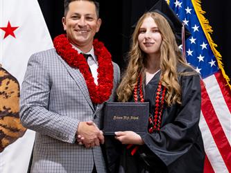 futures principal posing with graduating student